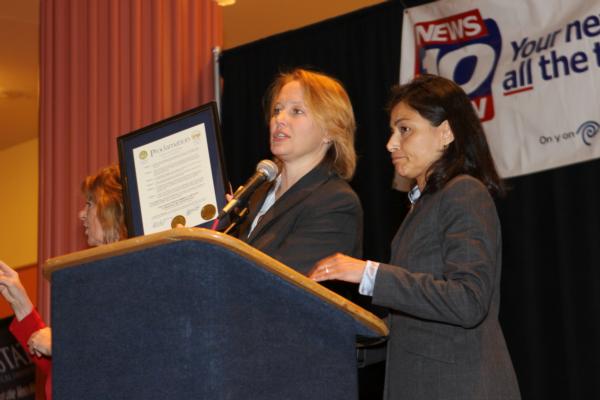 County Executive Joanie Mahoney and Juanita Perez Williams representing Mayor Miner, deliver a joint Proclamation recognizing the 17th Annual White Ribbon Campaign