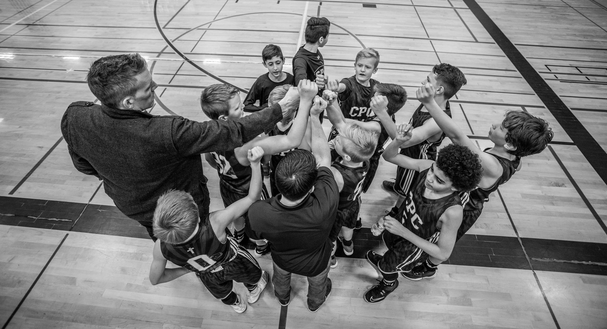 Basketball coach and team